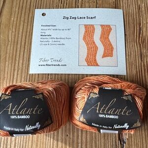 2 skeins Atlante orange 100% Bamboo Yarn with directions to knit lace scarf.